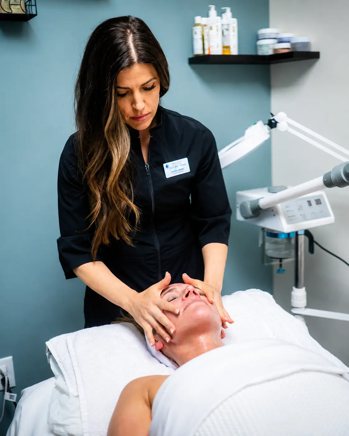 Esthetician performing a facial treatment at the LPWWC med spa